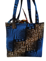 Upgrade your daily carry with our African Print Zip-Top Tote. Perfectly balancing functional design with high-impact aesthetics, this bag takes you from morning meetings to weekend brunch without missing a beat. Product Features: Secure Closure: Durable top zipper to keep your essentials safe. Spacious Design: Roomy interior for your laptop, makeup bag, and daily essentials. Sturdy Straps: Reinforced shoulder straps for comfortable all-day wear. Premium Fabric: 100% authentic African Wax Print (Ankara) with a structured lining.