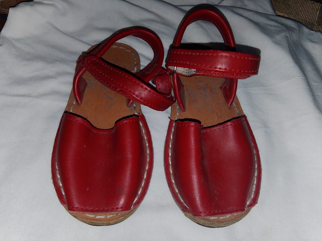 Specifications Brand: Rhoda Handmades. Material: High-quality leather upper and inner lining. Color: Classic White. Closure Type: Adjustable ankle strap with hook-and-loop fastening. Origin: Expertly handmade with attention to detail.