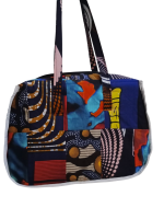 Upgrade your daily carry with our African Print Zip-Top Tote. Perfectly balancing functional design with high-impact aesthetics, this bag takes you from morning meetings to weekend brunch without missing a beat. Product Features: Secure Closure: Durable top zipper to keep your essentials safe. Spacious Design: Roomy interior for your laptop, makeup bag, and daily essentials. Sturdy Straps: Reinforced shoulder straps for comfortable all-day wear. Premium Fabric: 100% authentic African Wax Print (Ankara) with a structured lining.