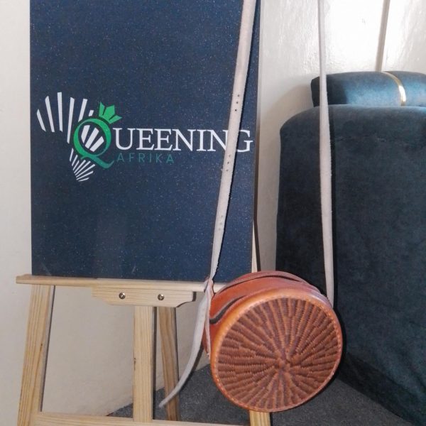 Specifications Material: Sustainable hand-woven fibers and genuine leather. Colorway: Midnight Black with a Royal Violet horizontal accent. Handle Style: Double shoulder straps for comfortable, all-day carry. Origin: Inspired by and crafted through traditional African weaving techniques.